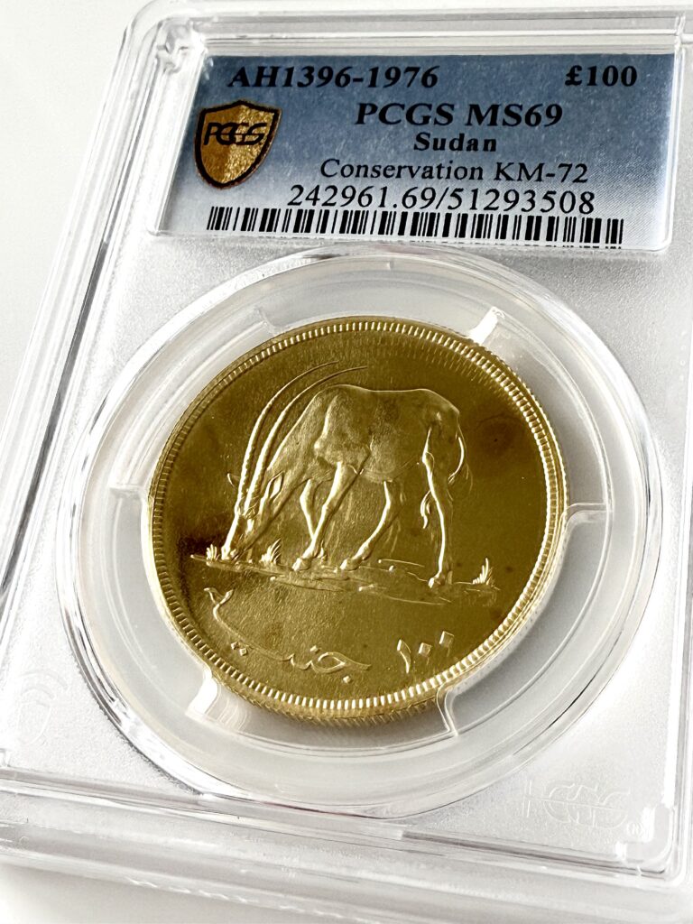 苏丹 100磅保护 Scmitar 收割机 Oryx 1396 1976 金色 PCGS MS69