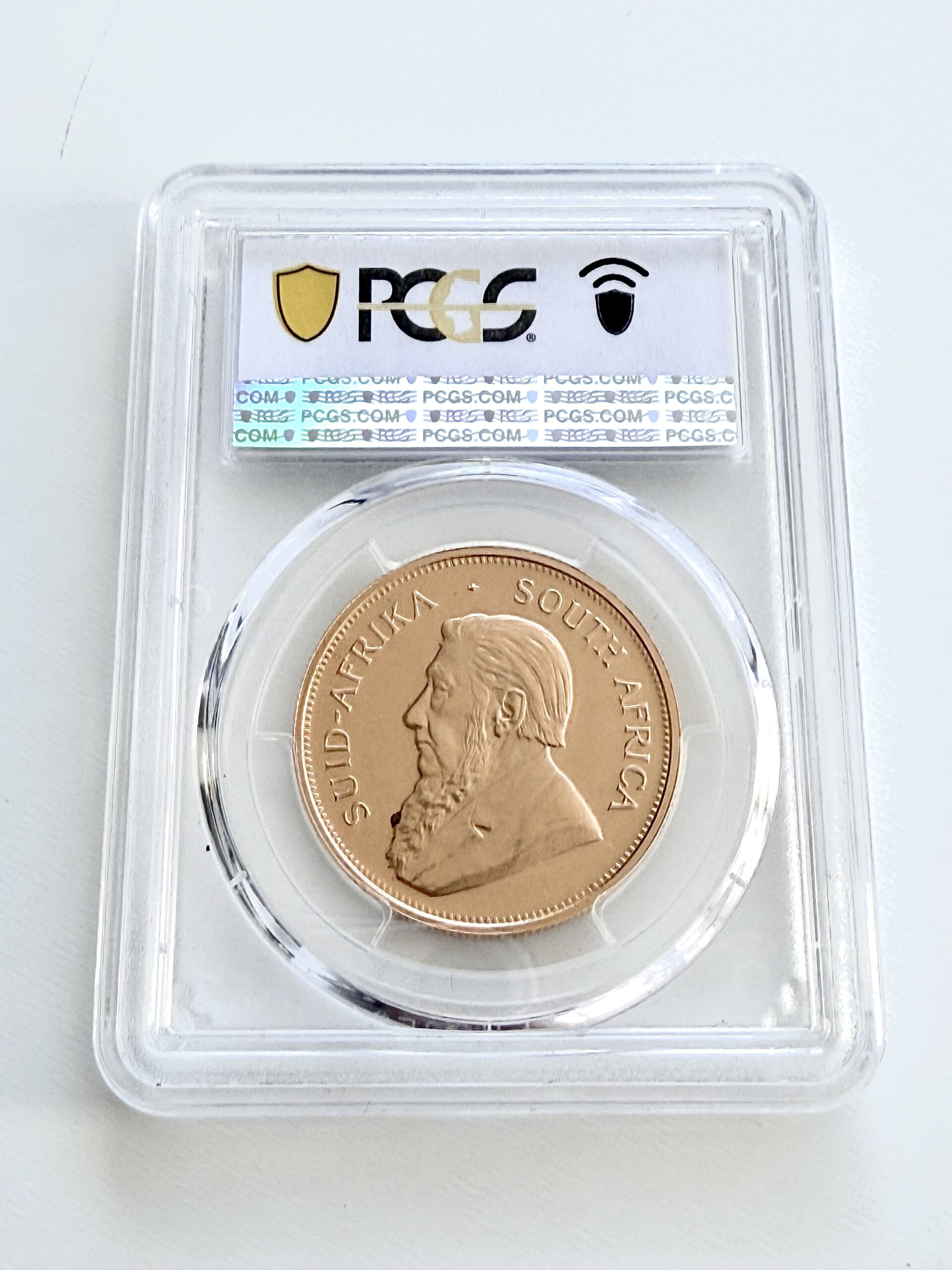 kruegerrand–1973–1oz-gold-pcgs-pr67-cam_2 Krugerrand 1973 1 oz Goldmünze in Proof, PCGS PR67 CAM – zertifizierte südafrikanische Sammlermünze mit klassischem Springbock-Design