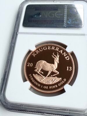Afrique du Sud-Krugerrand-2013-l’un-des-300-premiers-frappés-1-oz-bevel-or-ngc-pf70-ucam_1 Krugerrand 2013 1 oz Or Proof – l'une des 300 premières pièces frappées – NGC PF70 UCAM