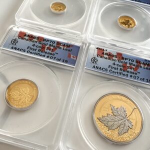 加拿大 2017 年枫叶金分数镶嵌在 ANACS 支架中;四枚大小不一的金币,标有“First Release”和“RP70 DCAM”。