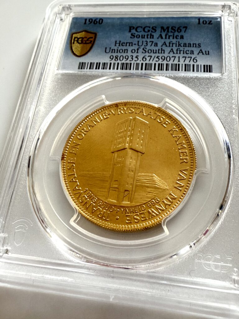South Africa 1960 Chamber of Mines “Goue Jubileum” 1 oz gold coin in PCGS slab; reverse features two springboks and the inscription “GOUE 1910–1960 JUBILEUM – UNIE VAN SUID-AFRIKA”.