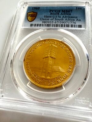 南非 1960 年矿业商会“Goue Jubileum”1 盎司 PCGS 板金币;背面有两只跳羚和铭文“GOUE 1910–1960 JUBILEUM – UNIE VAN SUID-AFRIKA”。
