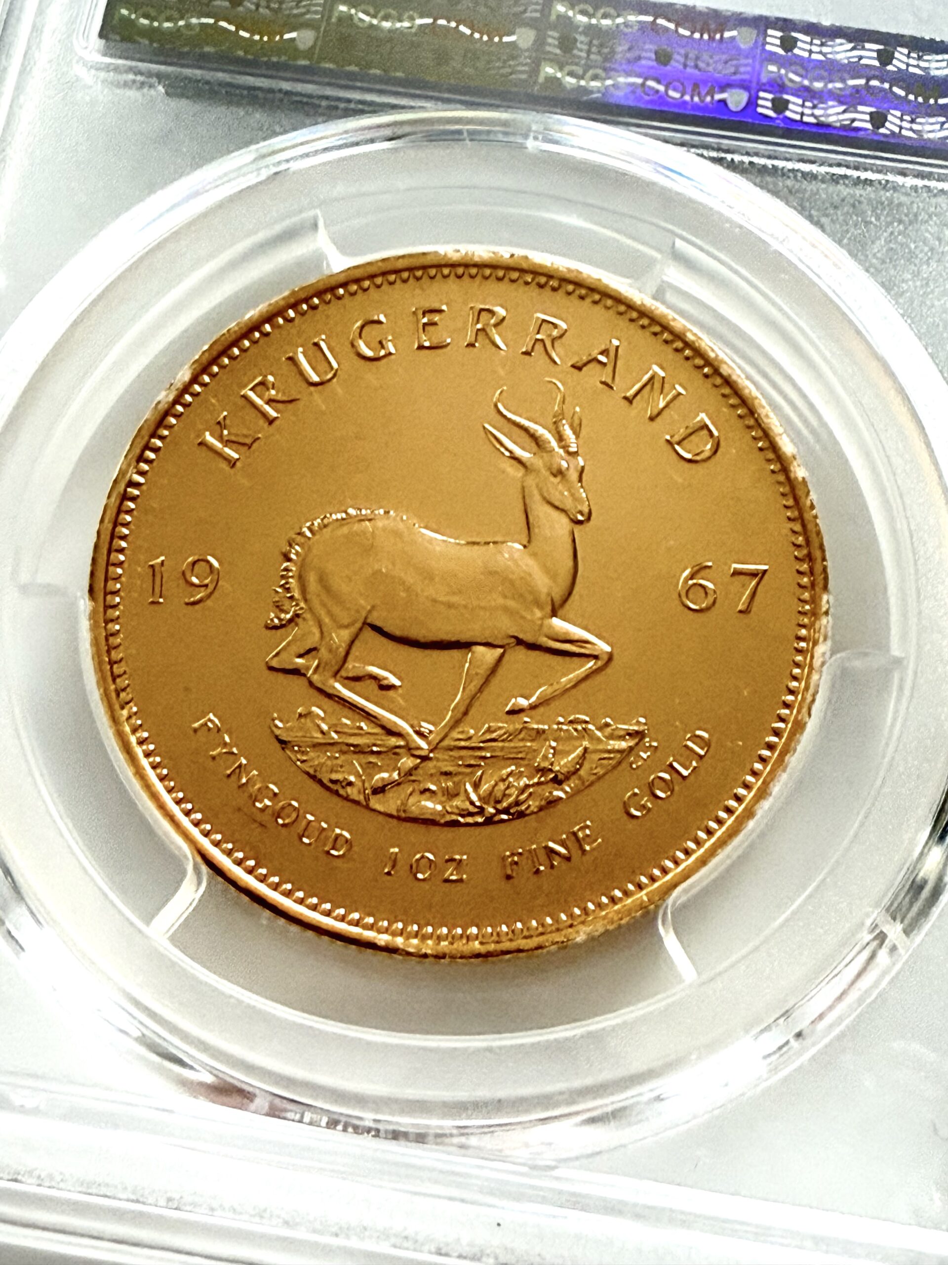 kruegerrand-1967-1oz-pcgs-pl66_6 PCGS zertifizierter Krügerrand 1967 zu 1 oz Gold, Einstufung PL66, Vorderseite im Original PCGS Holder.