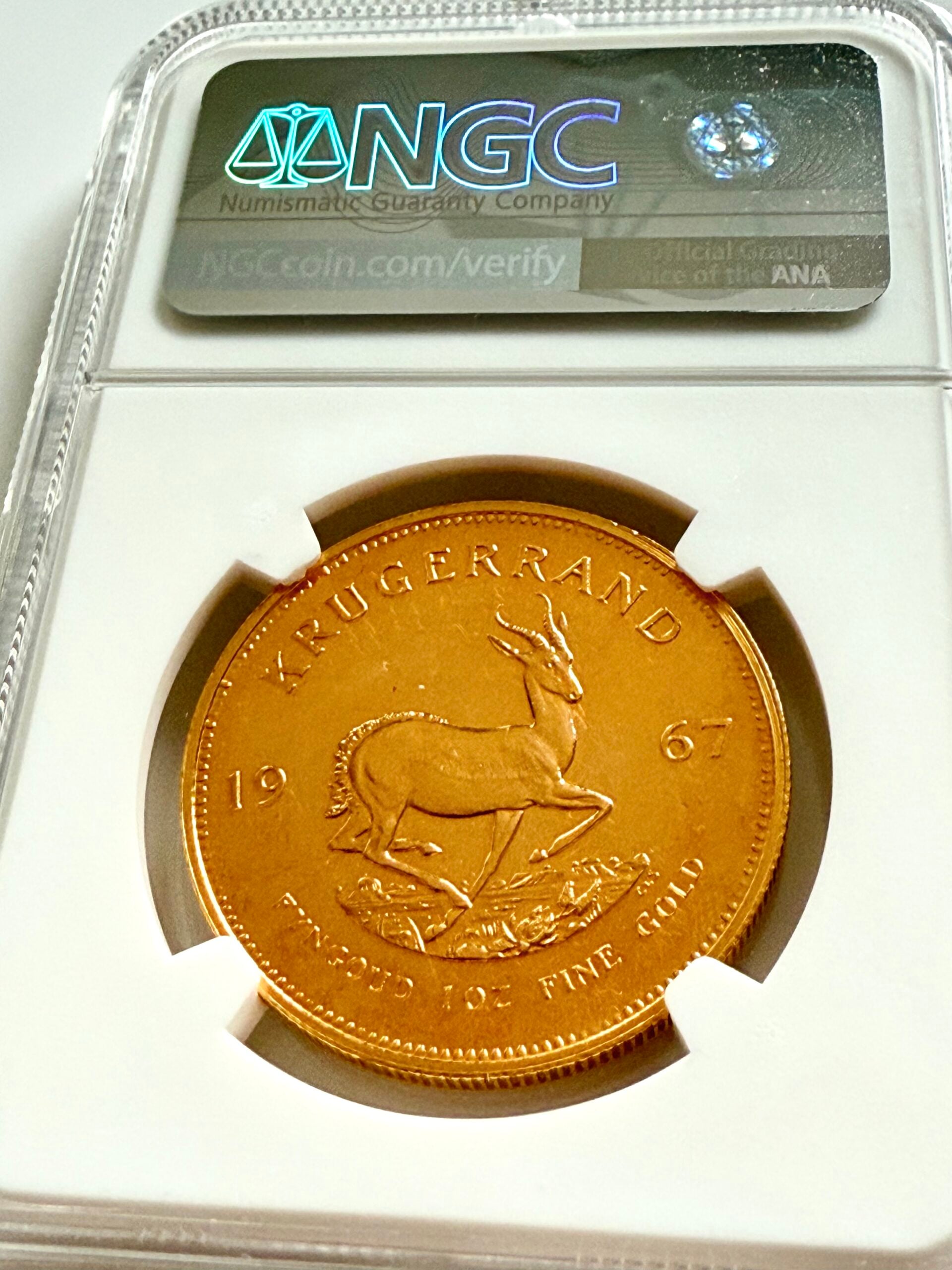 南非1967年克鲁格兰1盎司金质精制品,NGC持有人PF64,正面附保罗·克鲁格肖像,证书8583569-001