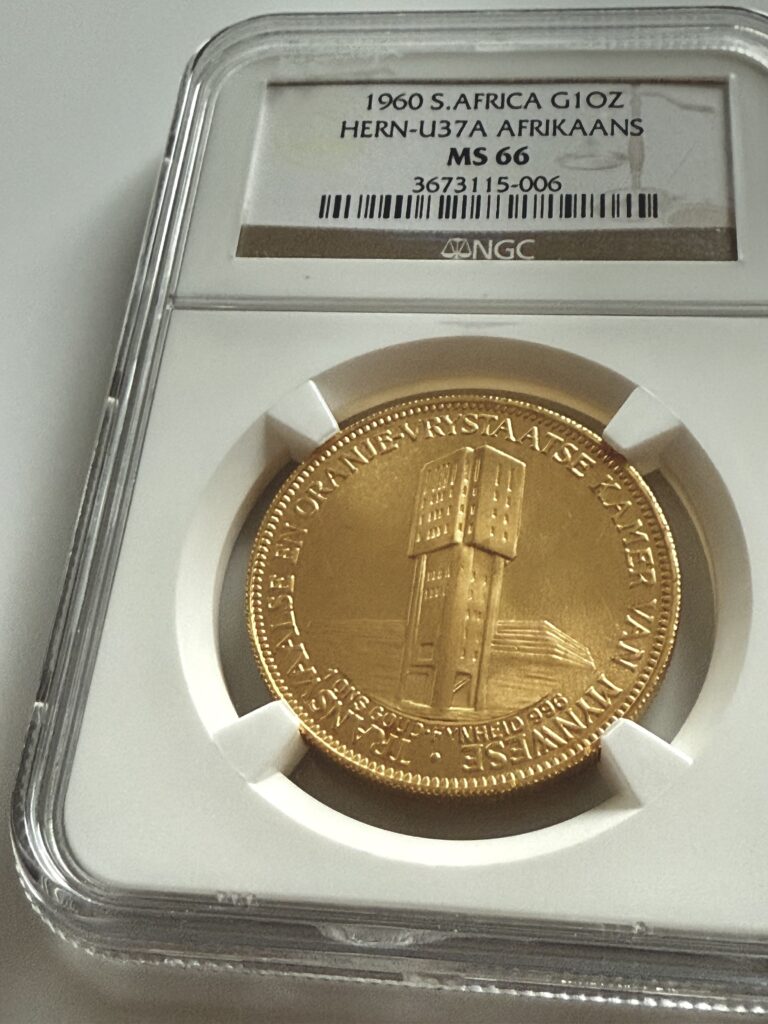 Sudafrica 1960 Camera delle Miniere 1 oz Oro Emissione Afrikaans NGC MS66 in contenitore trasparente
