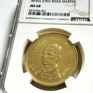 Thailand BE 2517 (1974) 5.000 Baht Goldmünze White-Eyed River Martin in NGC-Holder mit Erhaltungsgrad MS68.