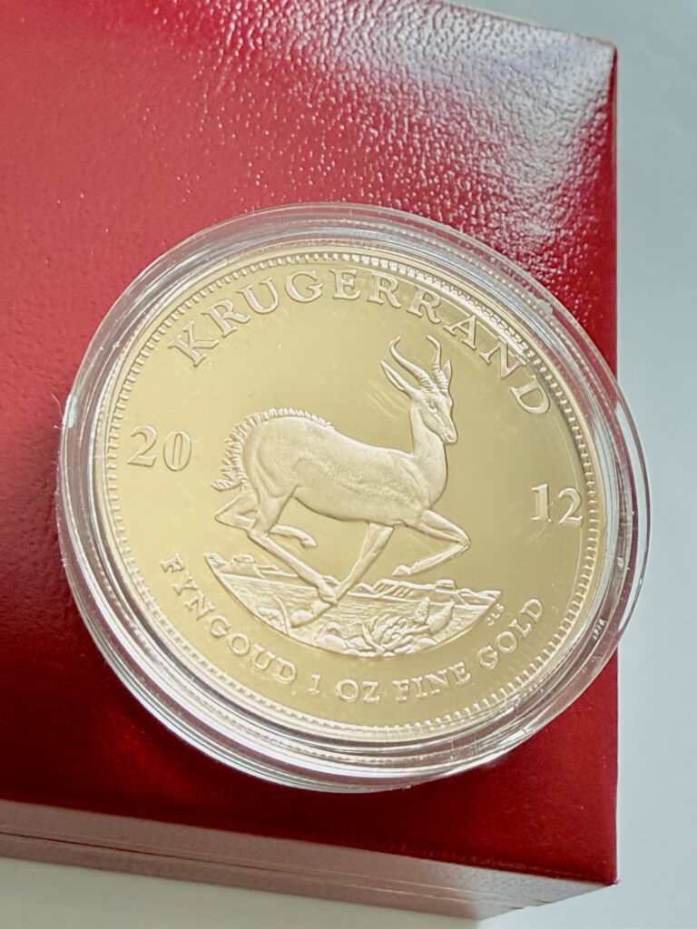 Südafrika - Krügerrand - 2012 - 1oz Gold Proof - Rückseite Springbock - in Kapsel auf rotem Etui