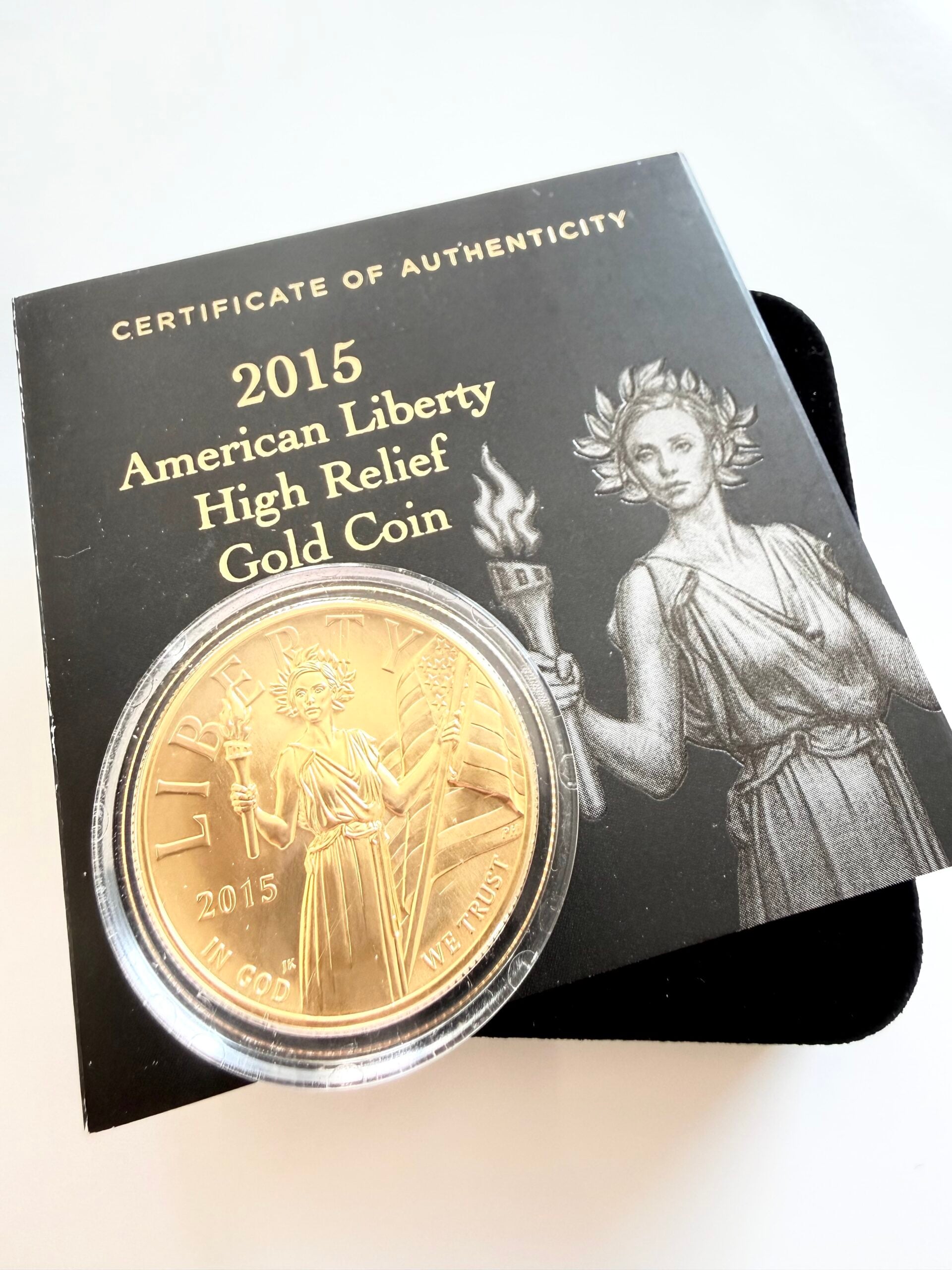 2015 American Liberty High Relief Gold Coin of the United States Mint in opened presentation box with capsule, certificate and original outer packaging.