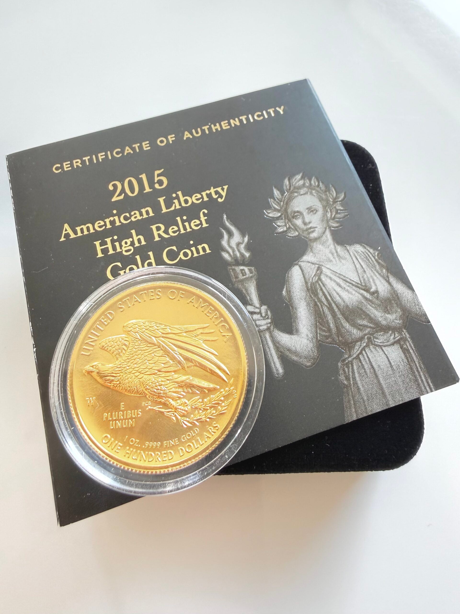 2015 American Liberty High Relief Gold Coin of the United States Mint in opened presentation box with capsule, certificate and original outer packaging.
