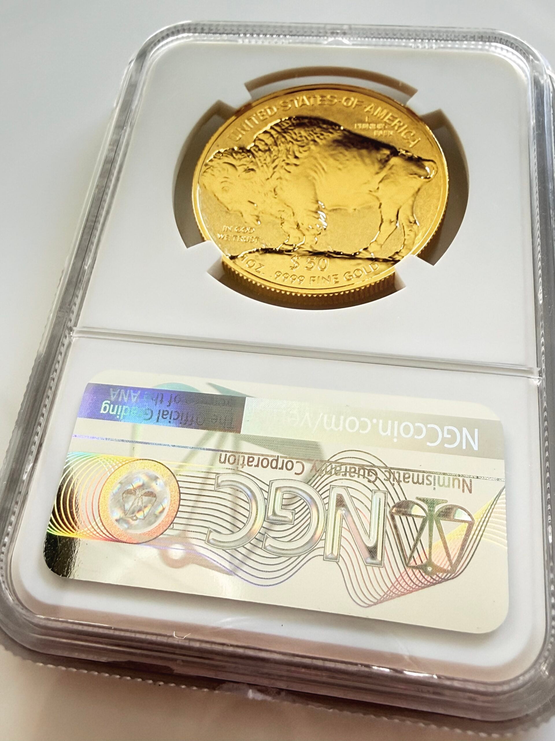 NGC-certified 1 oz gold Buffalo coin from the USA, minted in 2013. The label reads "2013 WG$50 - Buffalo - .9999 Fine - Reverse PF 70" and bears the certification number 5946855-001. The coin is photographed in an NGC slab against a white background and features the portrait of a Native American.