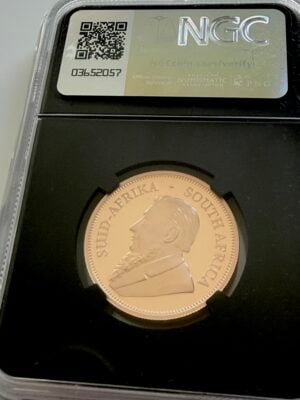 kruegerrand-2004-1-2oz-ngc-pf70-ultra-cameo_2 NGC-certified 1/2 oz South African Krugerrand gold coin from 2024. The label reads "Krugerrand 6pc Prestige Set - 2024 S. Africa Gold 1/2KR - PF 70 Ultra Cameo" and the certification number 8319310-039. The coin is photographed in an NGC slab against a white background and features the springbok antelope.