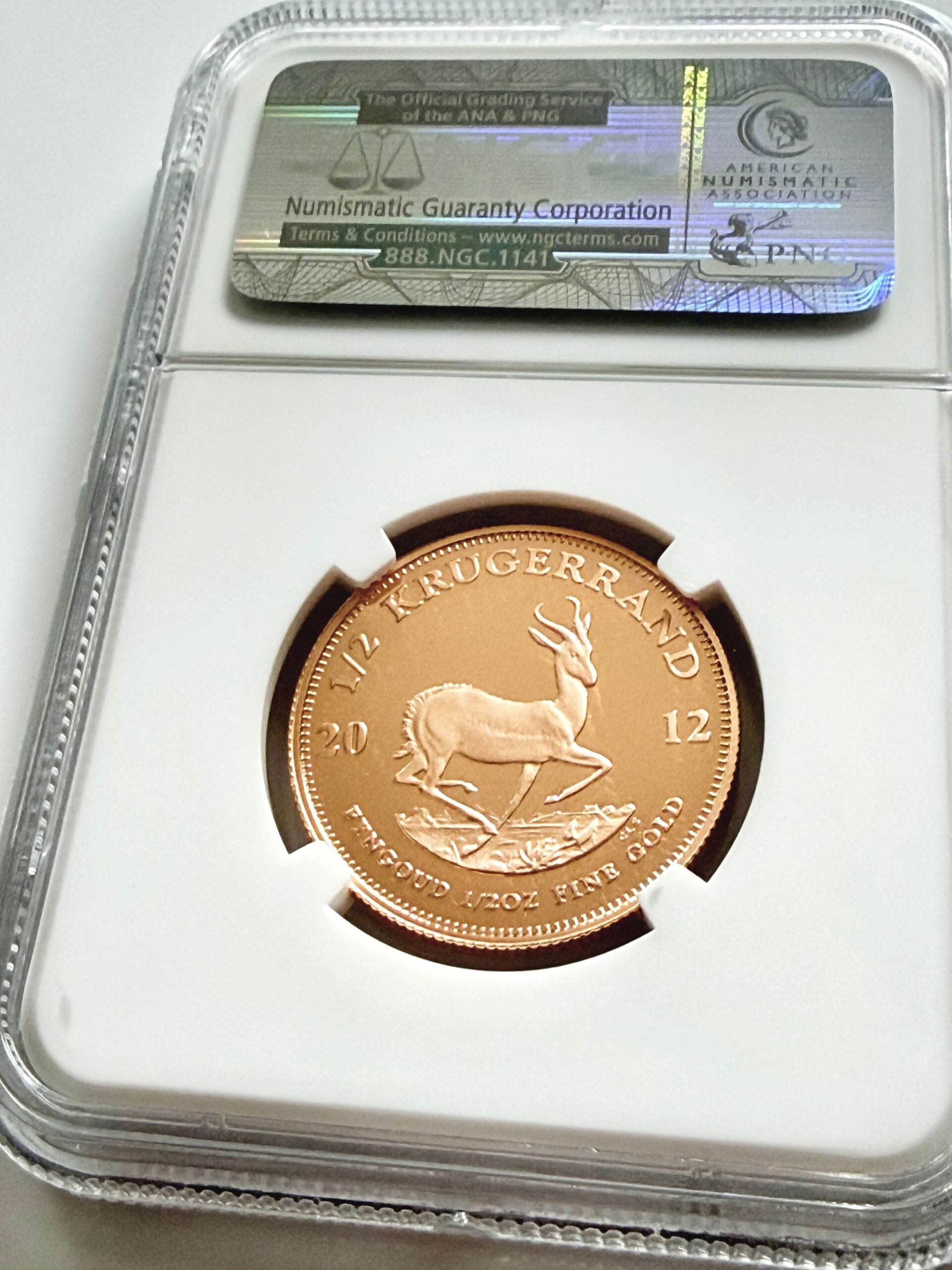 Moneta commemorativa Krugerrand 2012 da 1/2 oz in oro, versione Proof, certificata NGC PF70 Ultra Cameo Top Pop con Springbok.